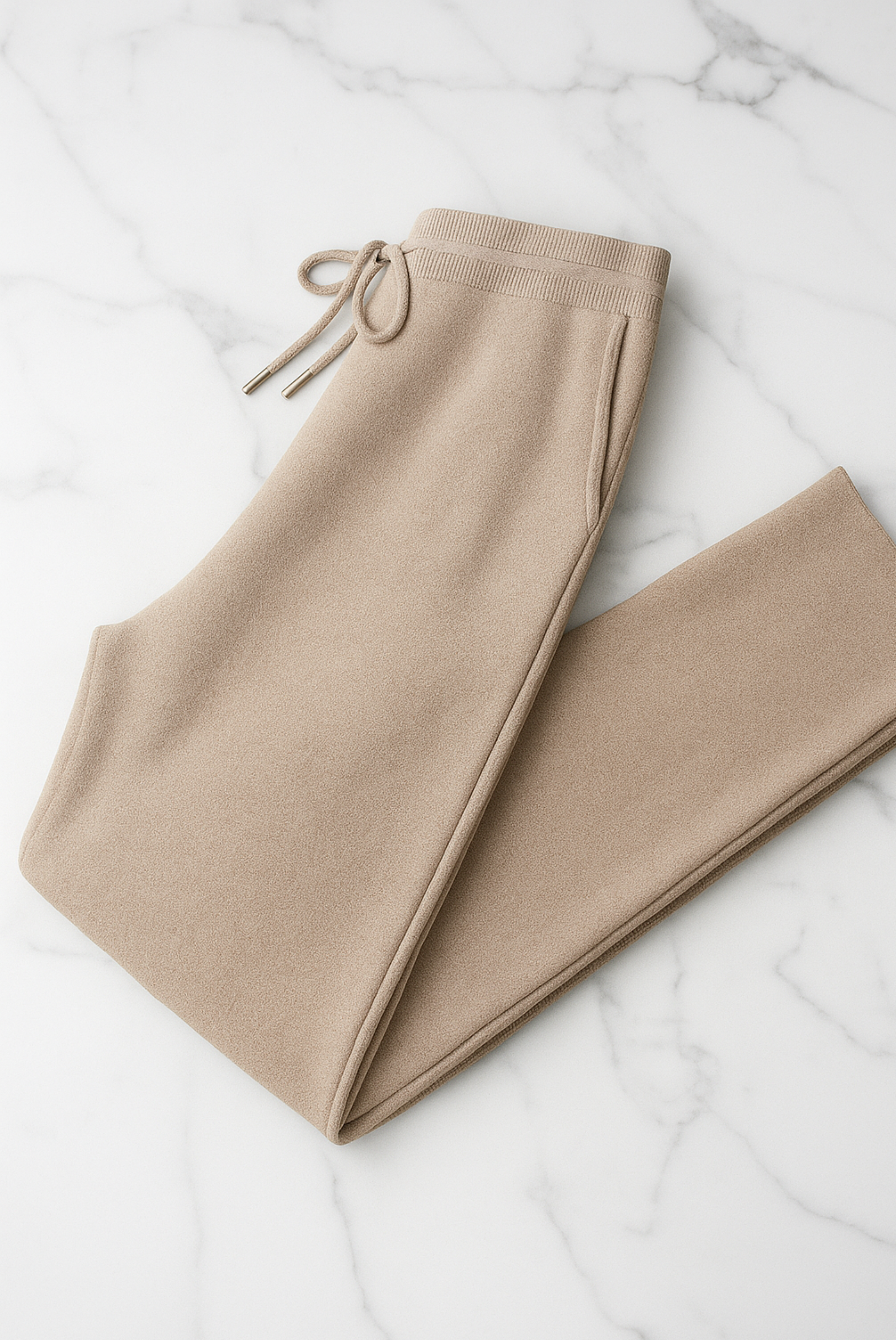 Beige Merino Nocturne sweater set by Emiral Couture displayed on a neutral background, showcasing its soft texture and elegant design.