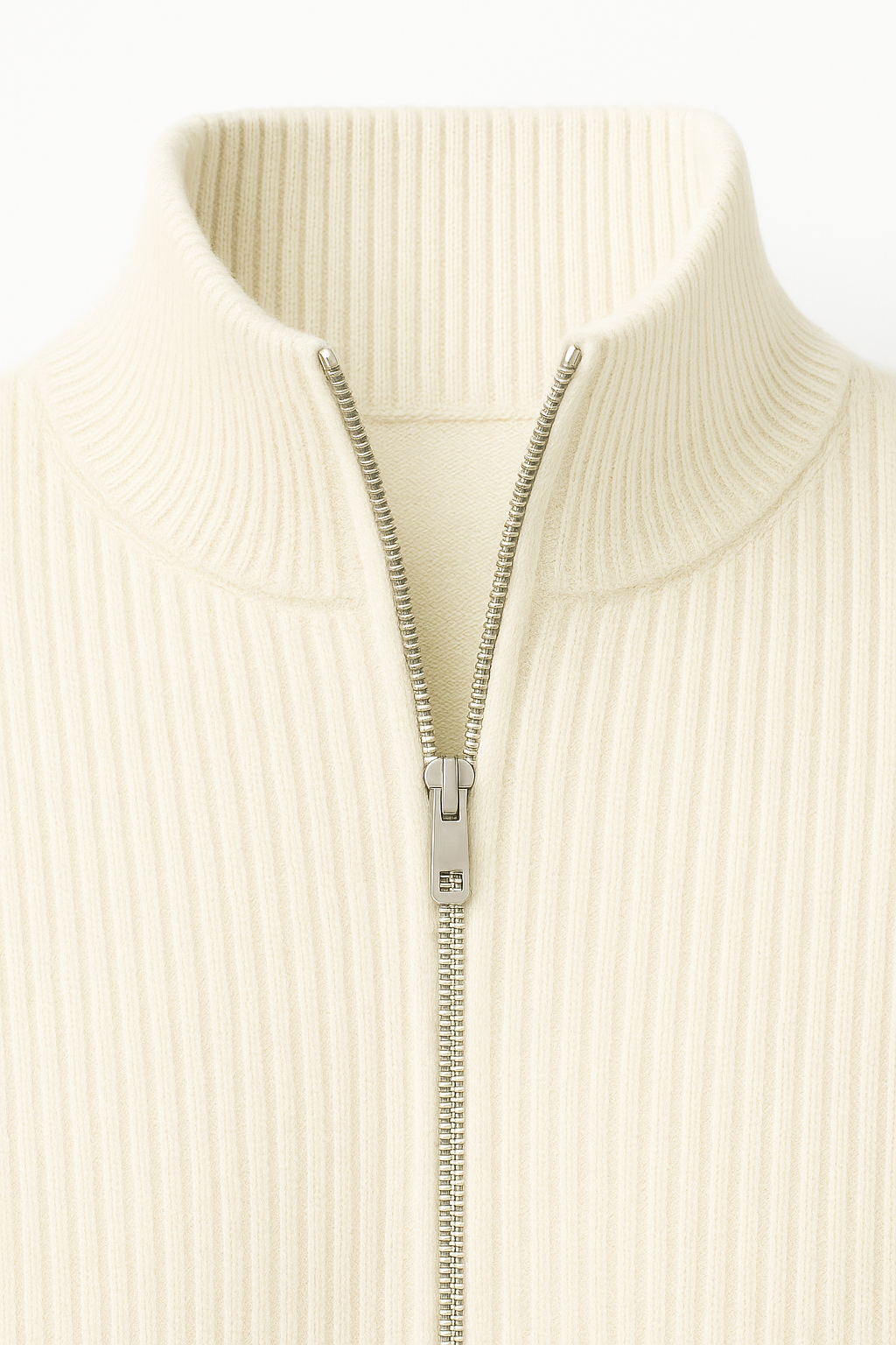 Cream cashmere cardigan with a zipper by Emiral Couture, showcasing a soft texture and elegant design.