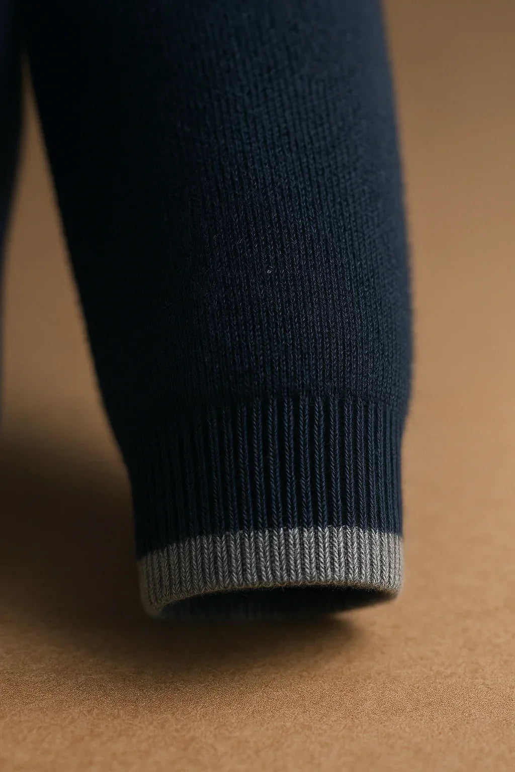 Emiral Couture classic half zip black sweater featuring a cozy wool cuff detail.