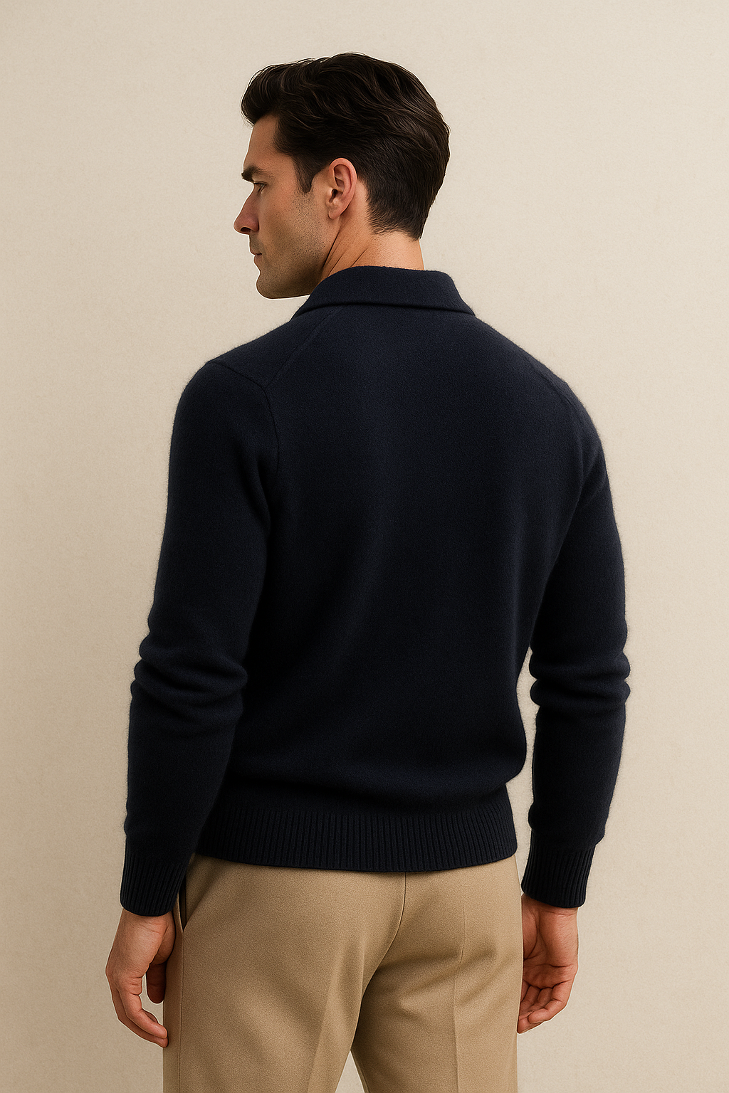 Navy cashmere polo knit sweater by Emiral Couture with a classic collar and ribbed cuffs.