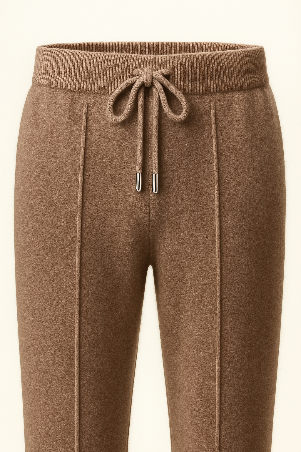 Brown cashmere trousers by Emiral Couture, featuring a tailored fit and soft texture, showcased on a neutral background.