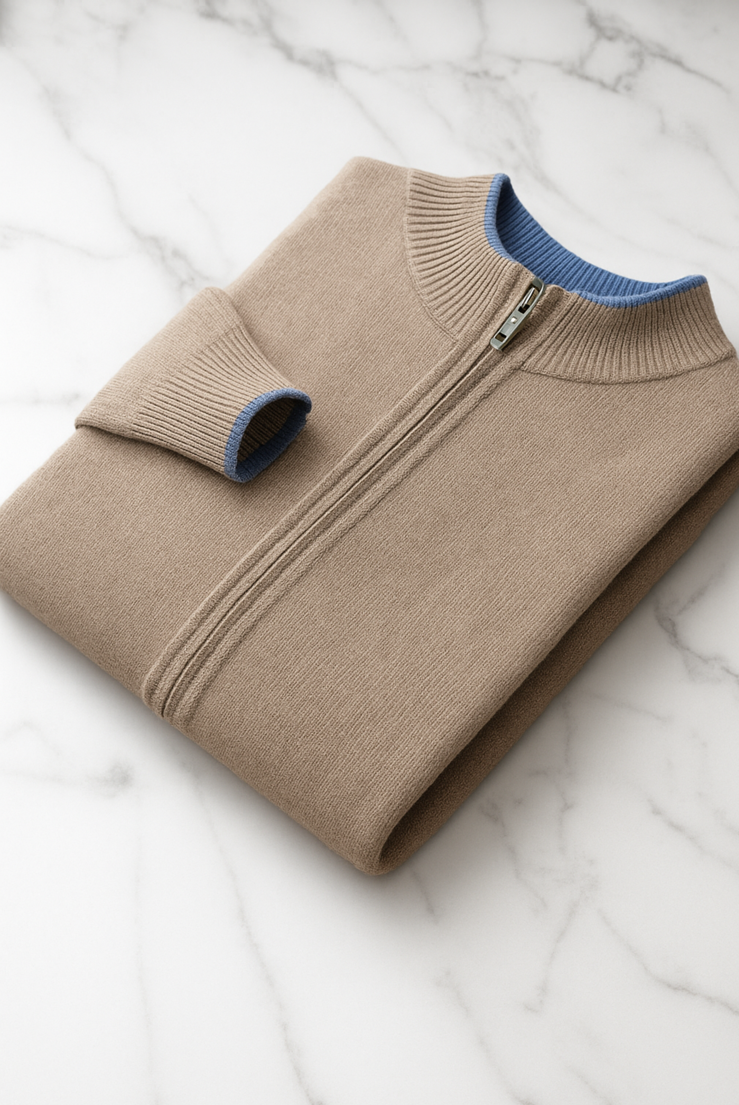Beige merino wool sweater from Emiral Couture, featuring a soft texture and relaxed fit, perfect for cozy layering.