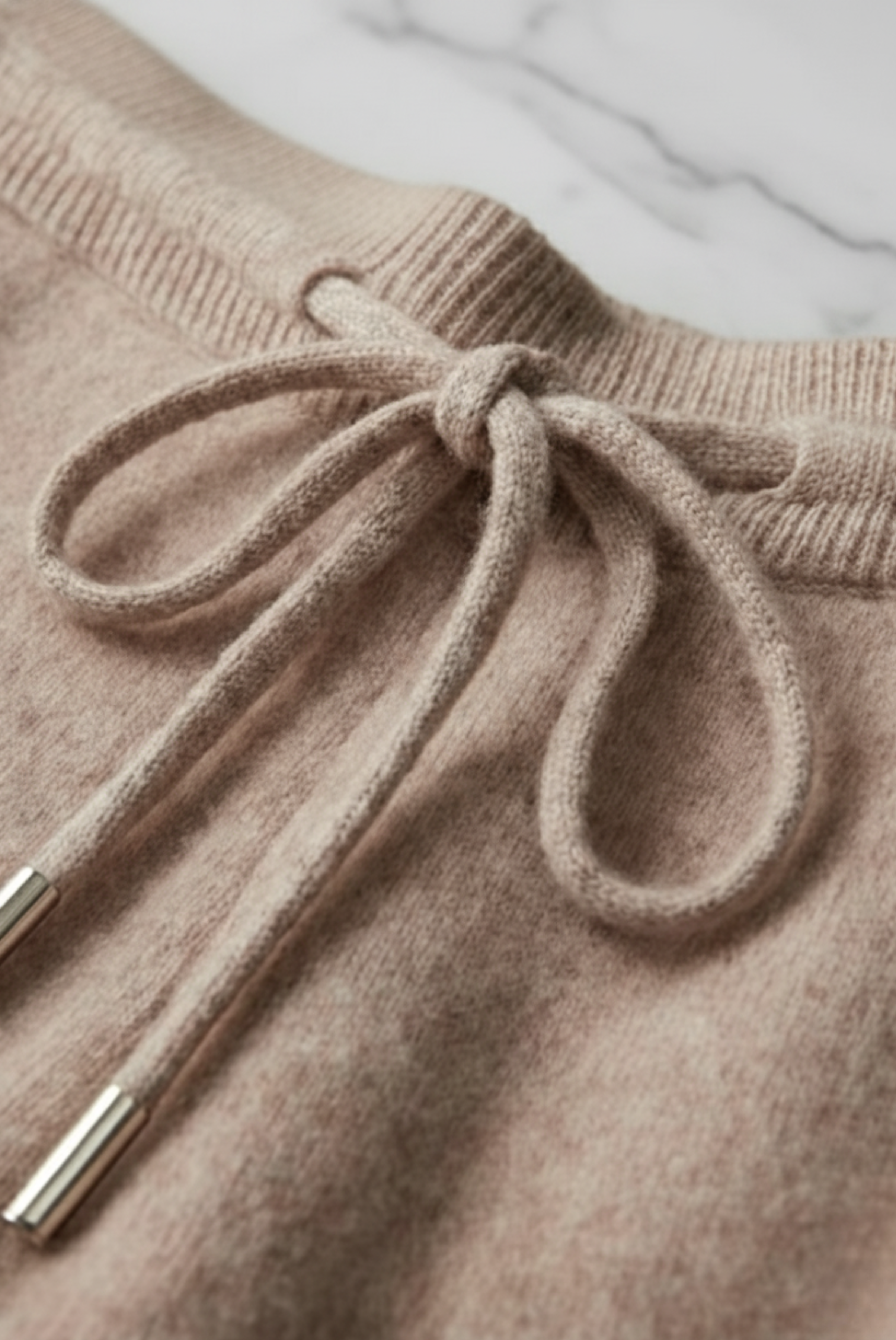 Beige merino wool sweater set from Emiral Couture with elegant, cozy design, perfect for cooler weather.