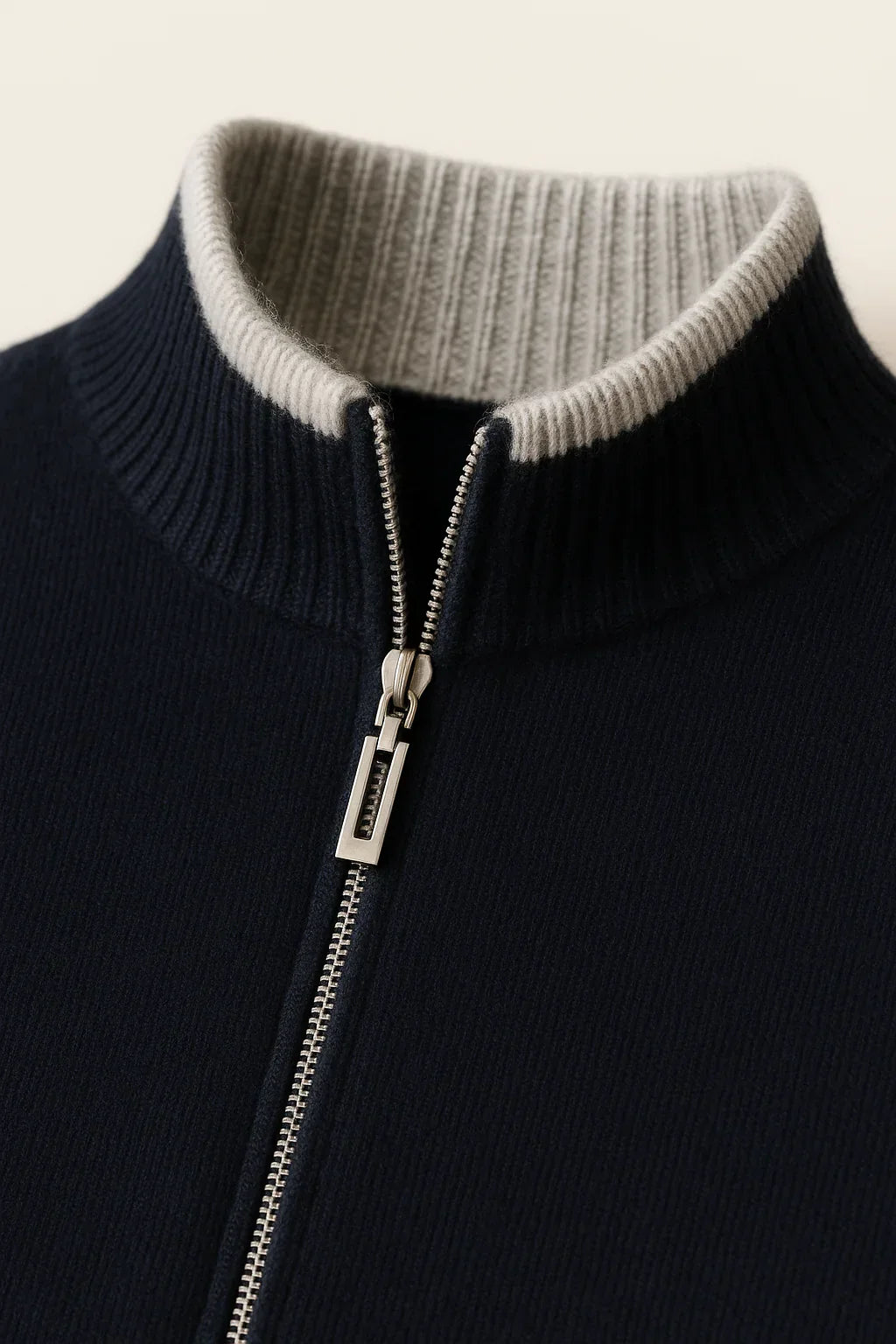 Emiral Couture classic half zip black cardigan featuring a stylish collar detail and soft fabric texture.