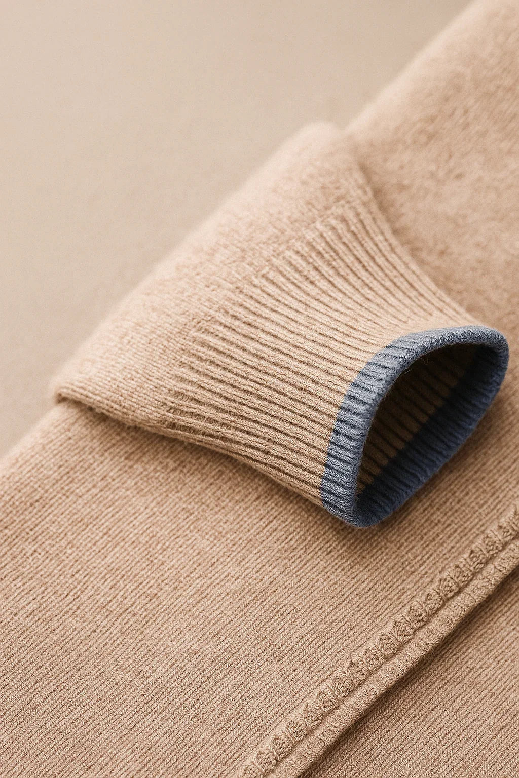 Beige classic half zip sweater by Emiral Couture featuring wool cuff detail and a stylish design.