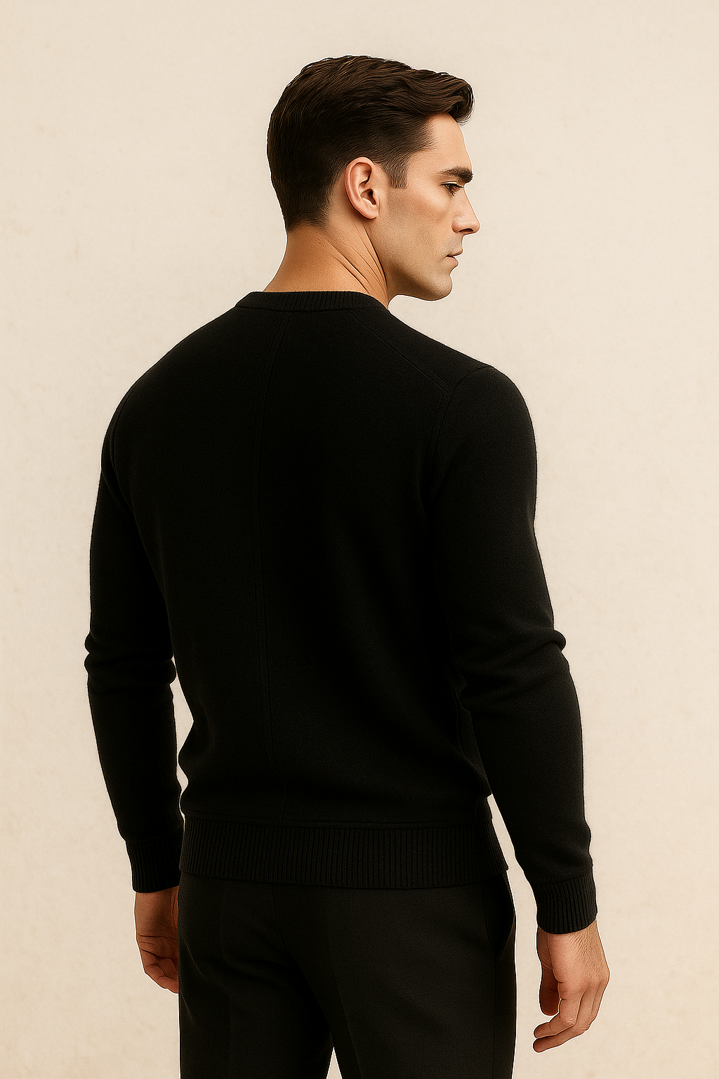 Model wearing a black cashmere knit sweater by Emiral Couture, showcasing its soft texture and elegant design.