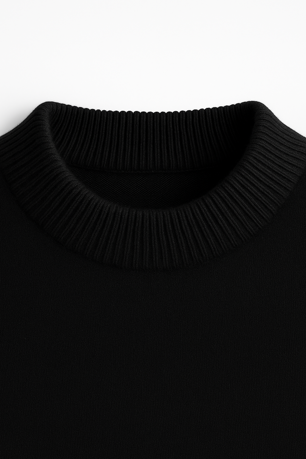 Emiral Couture black cashmere knit sweater with a classic design and soft texture, perfect for cozy layering.