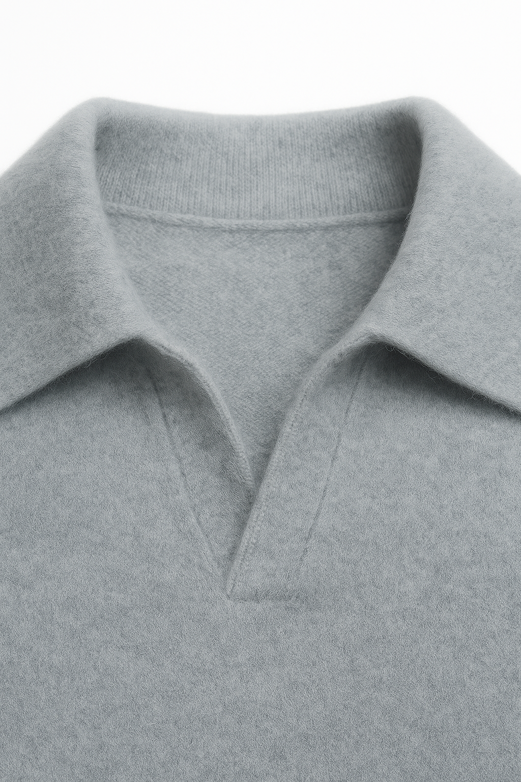 Light blue cashmere polo sweater by Emiral Couture, featuring a classic knit design and a refined silhouette.