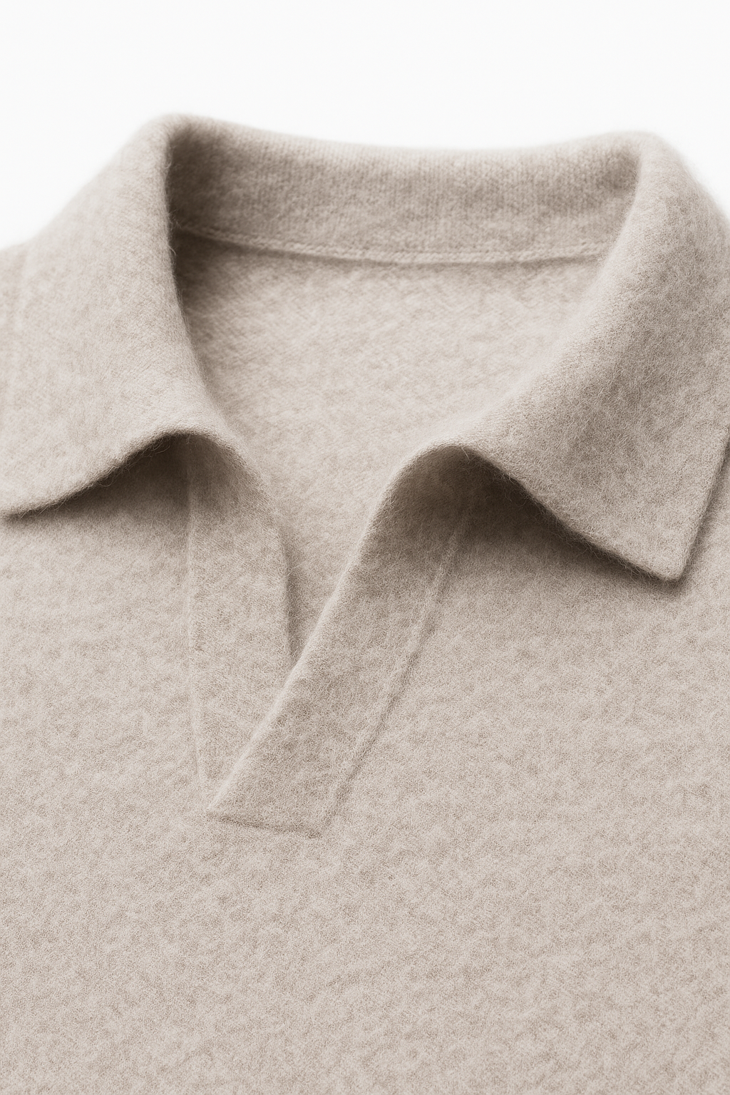 Grey cashmere polo knit sweater by Emiral Couture, showcasing a classic design and luxurious fabric texture.