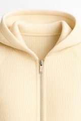 Beige Amici Merino hooded sweater by Emiral Couture, featuring a cozy design and soft fabric texture.