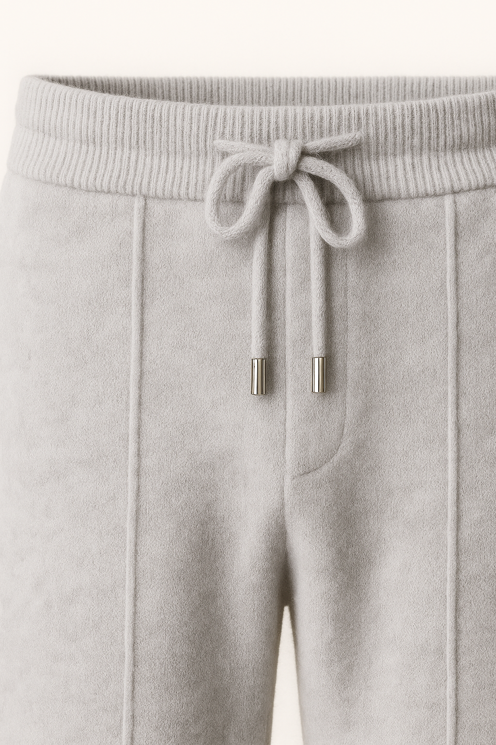Emiral Couture grey cashmere trousers showcasing a luxurious fabric and tailored fit.