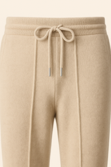 Beige cashmere trousers by Emiral Couture, featuring a tailored fit and soft texture, ideal for stylish comfort.