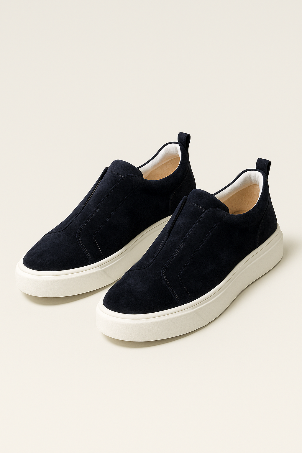 Navy suede slip-on sneakers by Emiral Couture, featuring a sleek design and comfortable fit for casual wear.