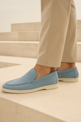 Light blue suede loafers by Emiral Couture with a sleek design and comfortable fit, perfect for casual or semi-formal wear.