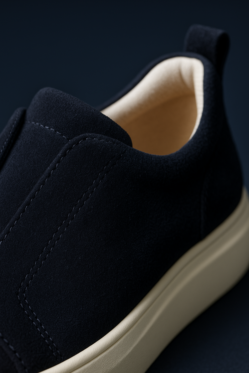 Navy suede slip-on sneaker by Emiral Couture with a sleek design and textured detailing.