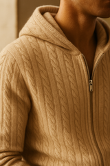 Beige cable knit hoodie with a hood from Emiral Couture, featuring intricate patterns and a cozy design.