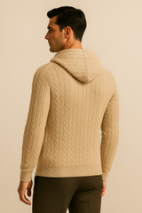 Beige cable knit hoodie with a hood from Emiral Couture, showcasing intricate knit patterns and a cozy design.