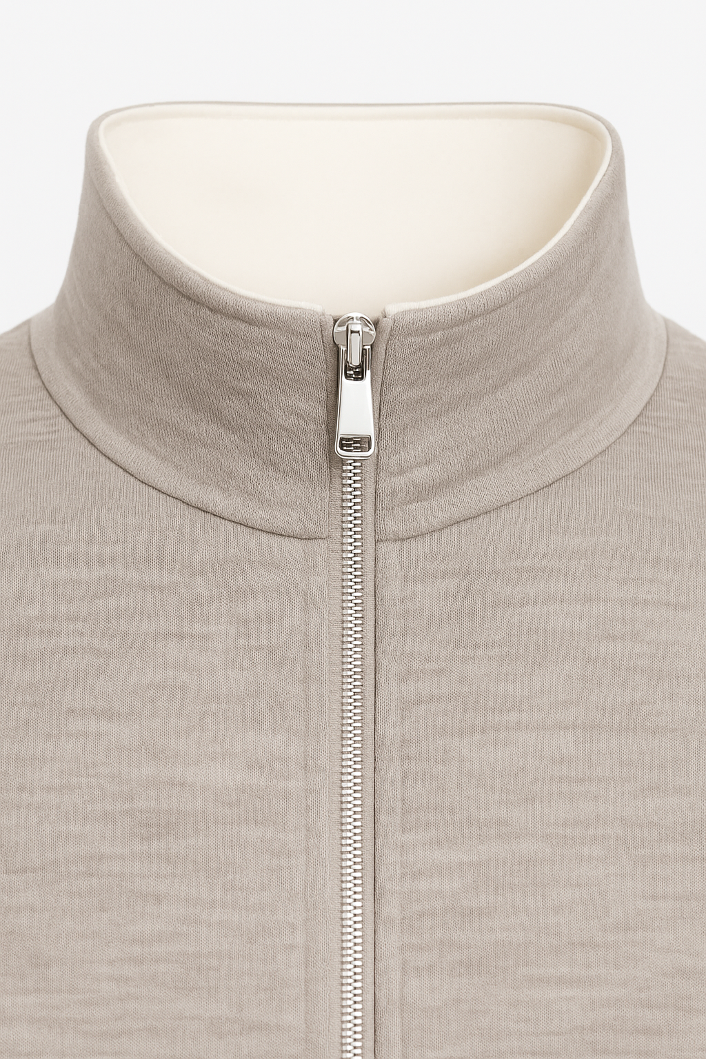 Ivory Reverso Bomber Jacket by Emiral Couture featuring a chrome zipper and a sleek, stylish design.