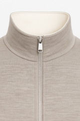 Ivory Reverso Bomber Jacket by Emiral Couture featuring a chrome zipper and a sleek, stylish design.