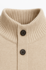 Emiral Couture sand cashmere cardigan featuring a soft texture and elegant design, perfect for layering.