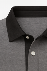 Grey polo shirt by Emiral Couture made from premium gabardine fabric, featuring a classic collar and short sleeves.