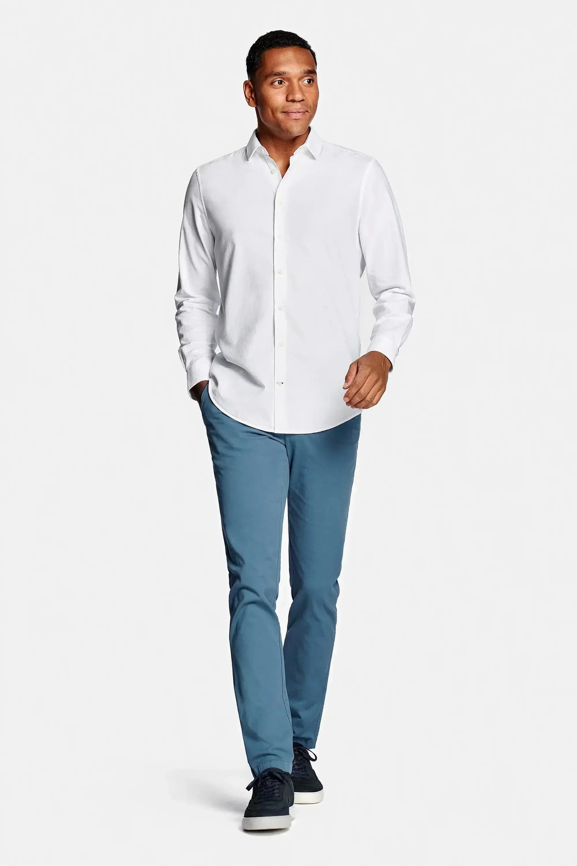 White cotton chemise from Emiral Couture, featuring a classic design and tailored fit, displayed on a neutral background.