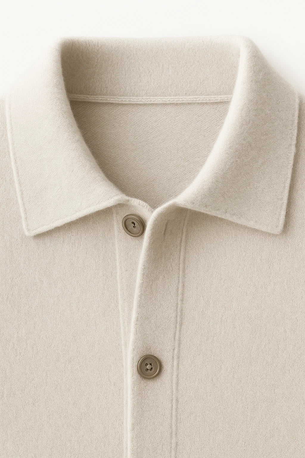 Ivory Vicenza cashmere cardigan by Emiral Couture, featuring a soft texture and elegant design, draped on a mannequin.